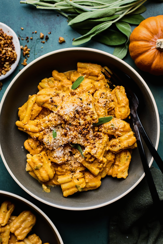 Mouthwatering finished dish piled high with velvety pumpkin sauce and shards of crispy prosciutto—your new favorite weeknight meal ready in a flash.