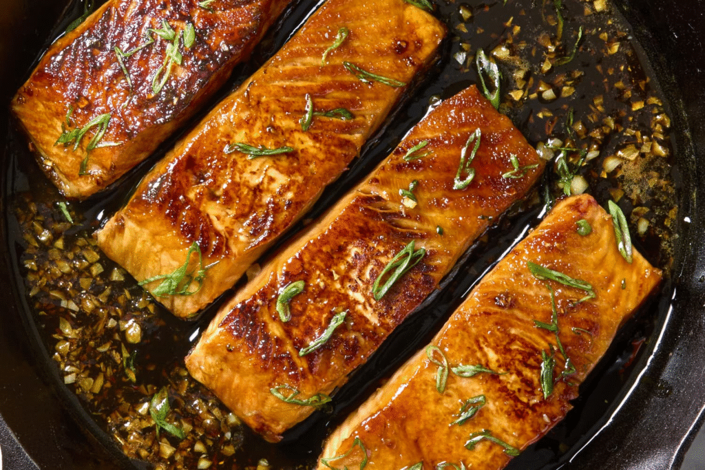 Flaky, tender honey garlic glazed salmon piled high with a glossy, sticky sauce and a confetti of fresh scallions—your new favorite 20-minute dinner ready in a flash.