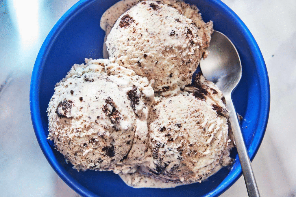A scoop of creamy, white no-churn cookies and cream ice cream bursting with chunks of chocolate Oreo cookies—the ultimate easy, nostalgic dessert.